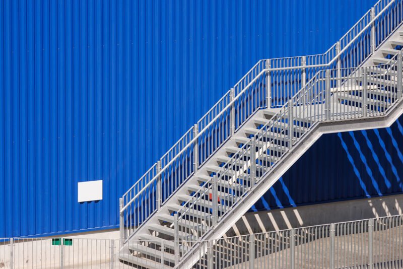 fire exit stair of large factory building. galvanise metal stair step. Space Saving Prefabricated Spiral Steel Staircase _ Custom Design for Indoor_Outdoor Use _ Easy Installation