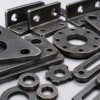 Complex shaped laser cut steel components with custom holes, slots and fabrication-ready profiles.