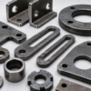 Laser cut metal parts installed in industrial structures and equipment manufacturing projects.